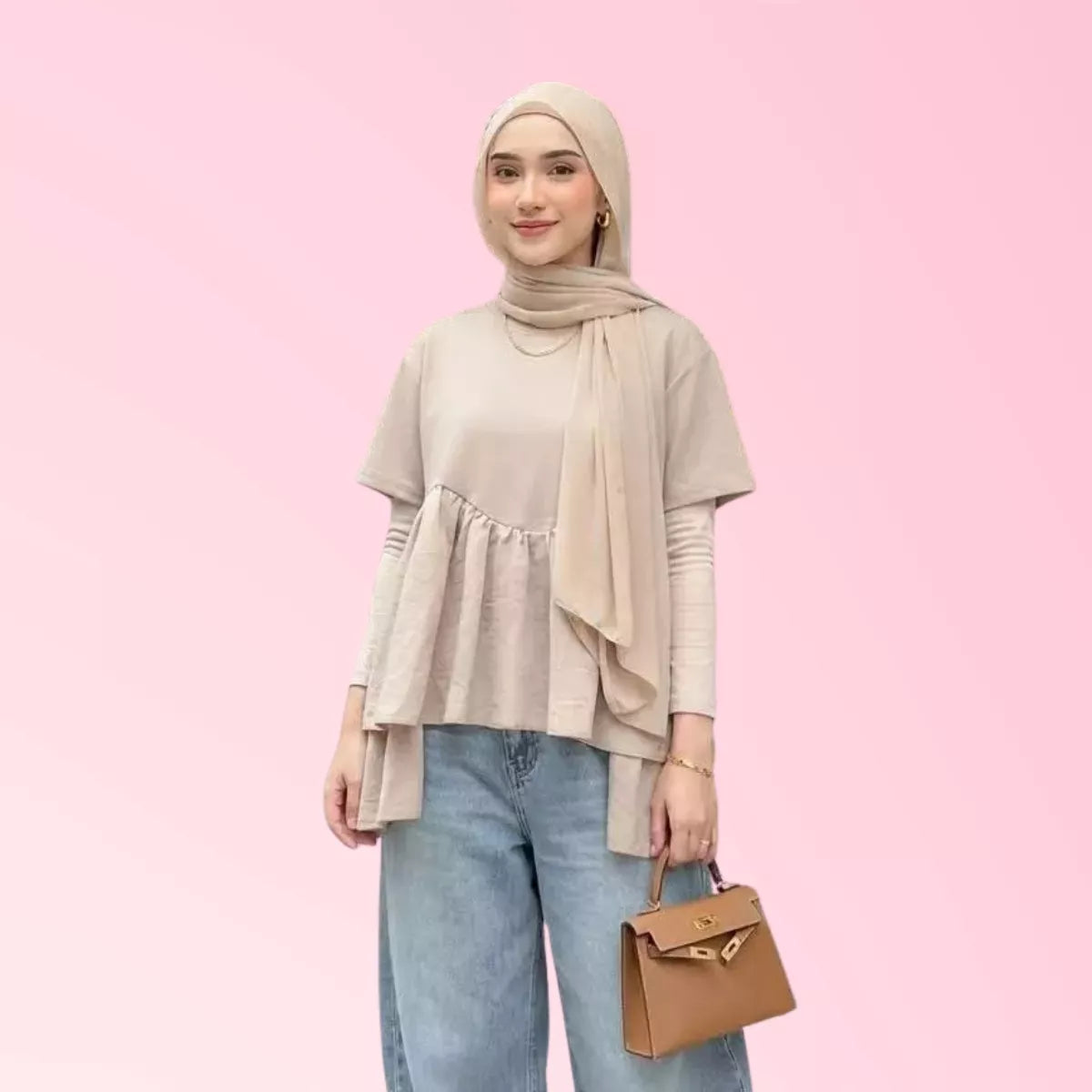 Blush layered peplum top for women styled with blue jeans