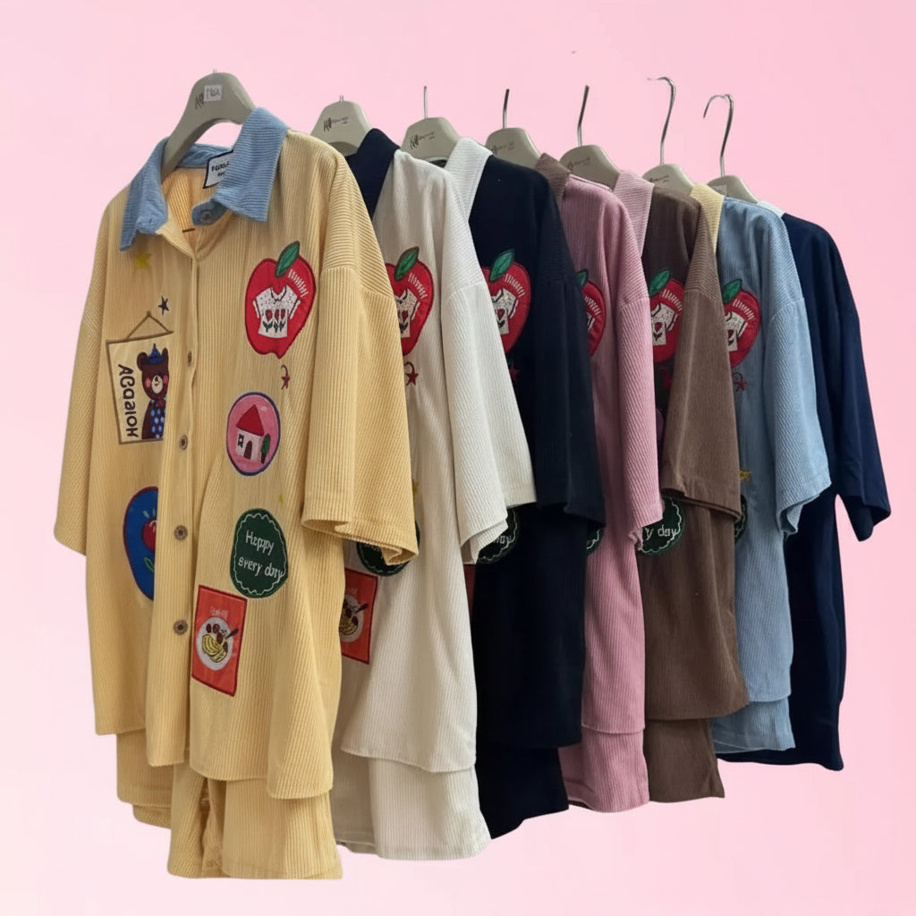 short-sleeve button-front shirts in multiple colors hanging on hangers