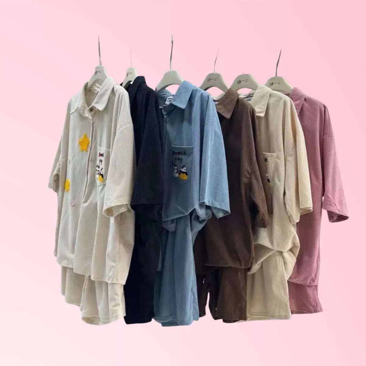 short-sleeve collared shirts in different colors (cream, black, light blue, brown, beige, and dusty pink)