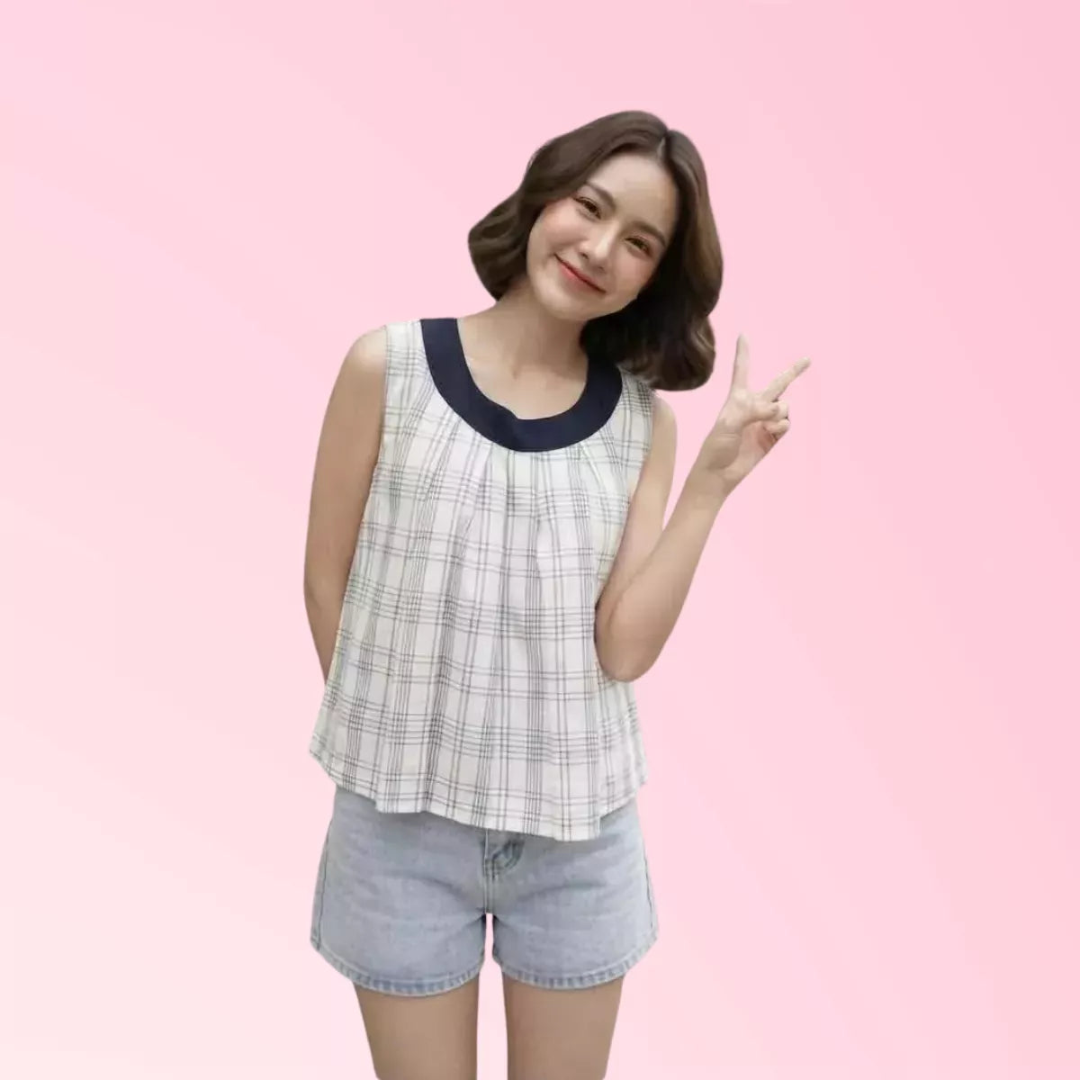 Women’s navy plaid sleeveless top with white contrast collar