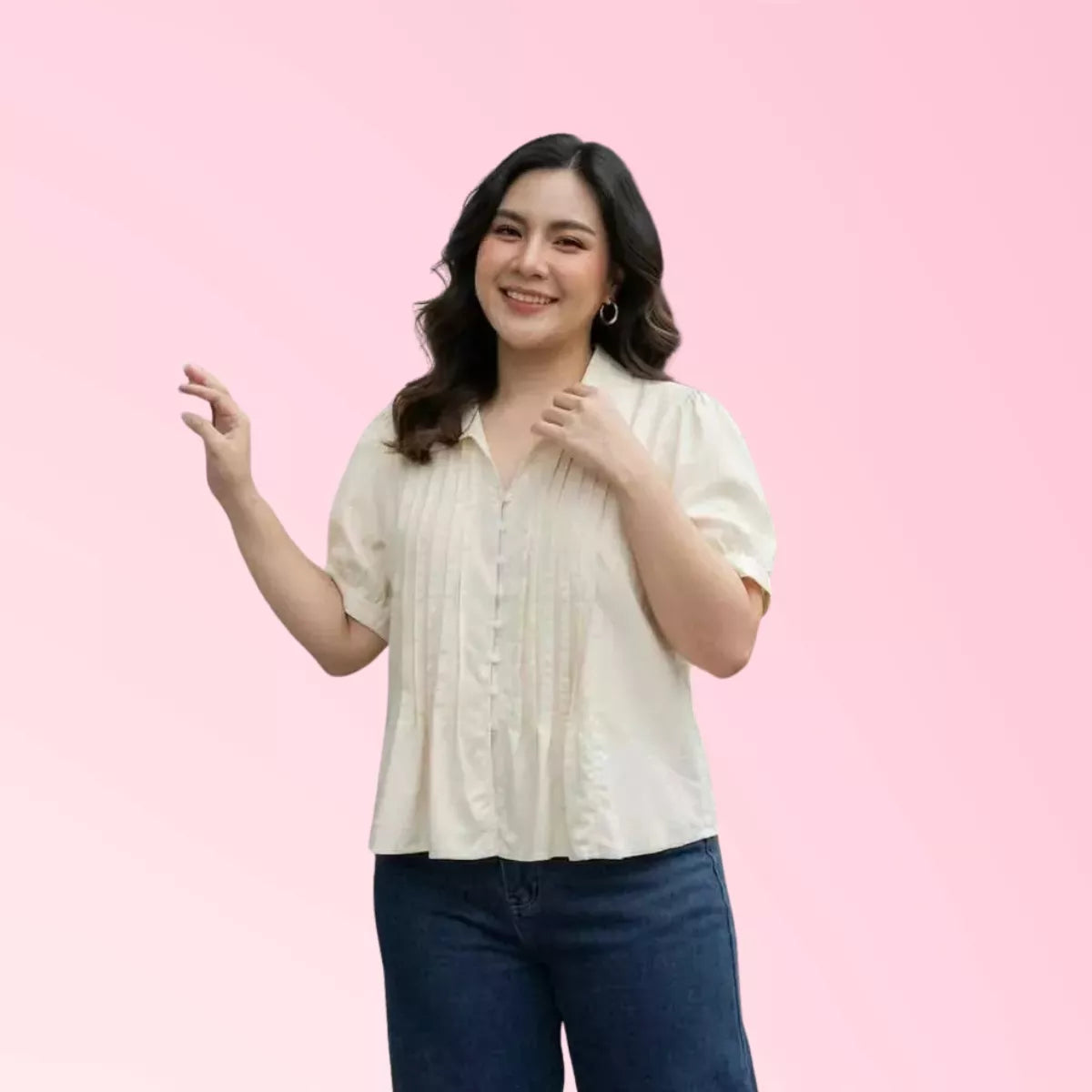 Woman wearing white pleated casual blouse with jeans