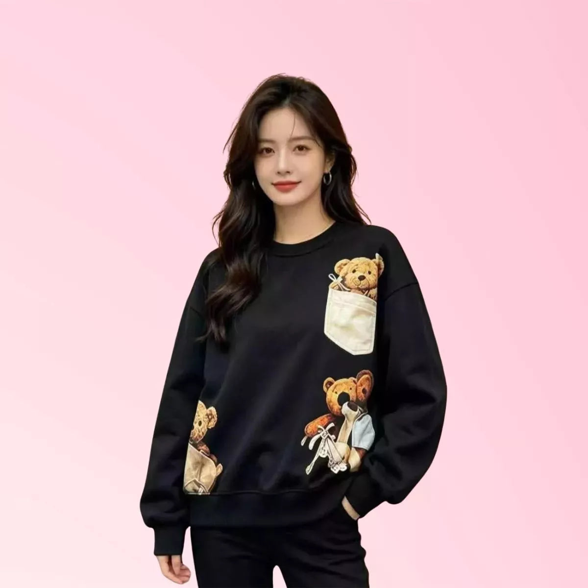 Women’s black teddy bear graphic sweatshirt with pocket detail